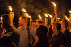 White nationalists carry torches on the grounds of the University of Virginia, on the eve of a planned Unite The Right rally in Charlottesville