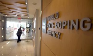 A woman walks into the head offices of WADA in Montreal