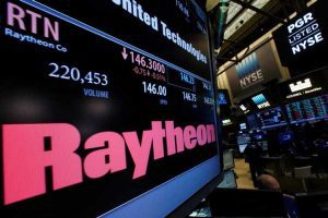 A screen displays trading information for Raytheon on the floor