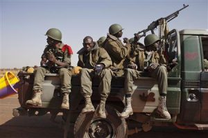 Malian soldiers heading to Gao in a pickup truck arrive in the recently liberated town of Douentza
