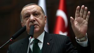 Turkish President Tayyip Erdogan addresses members of parliament from his ruling AK Party during a meeting at the Turkish parliament in Ankara