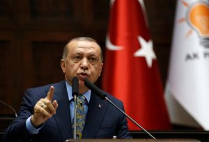 Turkish President Erdogan addresses members of parliament from his ruling AK Party during a meeting at the Turkish parliament in Ankara