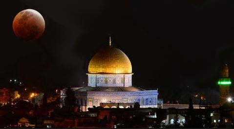 Partial lunar eclipse seen over Jerusalem shrines