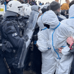 German police drag away activists protesting coal mine expansion