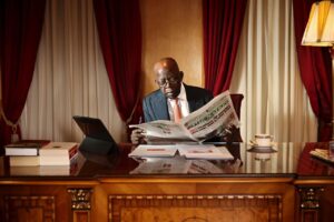 Tinubu-reading-Newspaper